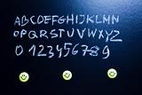 Alphabet and letters on a school blackboard