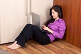 young lady on the floor with laptop