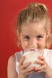 shot of a happy little girl drinking milk