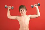 shot of a young kid pumping iron