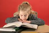 shot of child studying head down