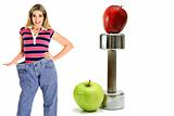 shot of weightloss workout apples in jeans