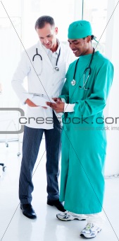 Two concentrated male doctors at work