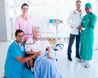 Attentive medical team taking care of a senior woman
