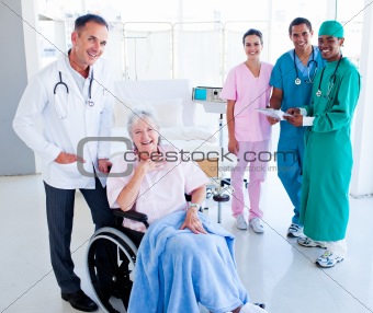 United medical team taking care of a senior woman 