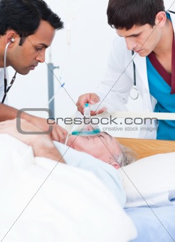 A doctor putting oxygen mask on a senior patient 
