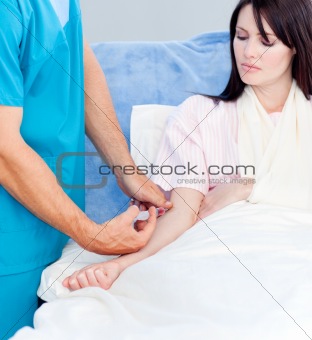 Close-up of a doctor giving an injection to a woman