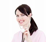 Charismatic female doctor showing a stethoscope 