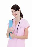 Sparkling female doctor holding patient's folder 