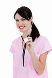 Radiant nurse showing a stethoscope against a white background