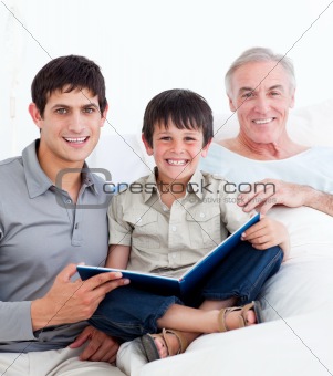 Laughing father and son visiting grandfather 