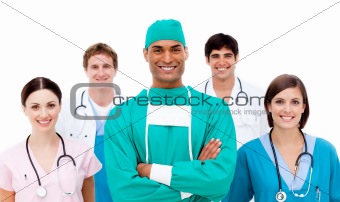 Confident surgeon with his team in the background