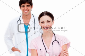 Attractive female doctor with her colleague in the background 