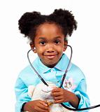 Cute little girl playing with a stethoscope 
