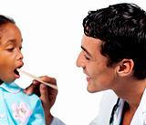 Male doctor checking little girl's throat 