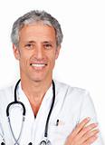 Mature doctor carrying a stethoscope