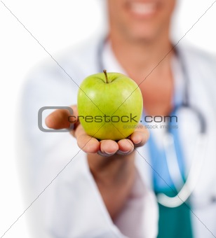 Close-up of a doctor presenting a green apple 