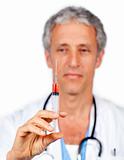 Self-assured doctor presenting a syringe