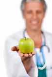 Doctor presenting a green apple 