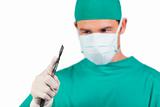 Self-assured surgeon holding a scalpel 