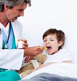 Child taking cough medicine