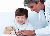 Cute Little boy playing with his doctor