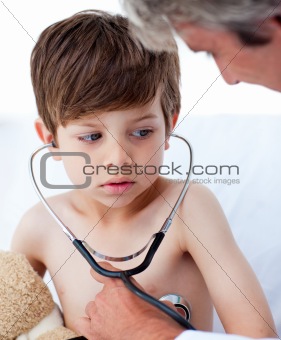 Little boy playing with his doctor