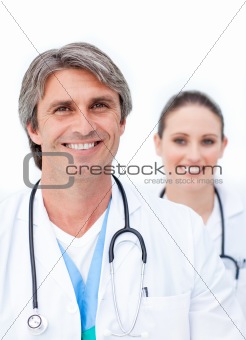 Positive doctors looking at the camera