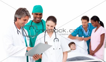 Positive male doctors looking at X-Ray in hospital