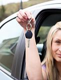 A driver holding a key after bying a new car 
