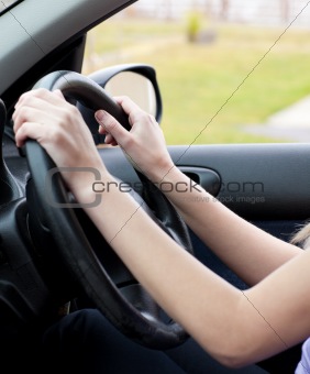 Close-up of a woman at the wheel 