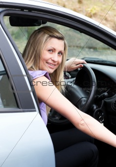 Young female driver at the wheel 