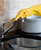 Close-up of a person cleaning a kitchen