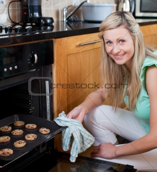 Happy woman baking cookies