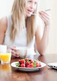 Cute woman having an healthy breakfast