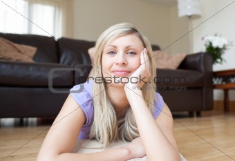 Attractive young woman lying on the floor