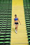 woman jogging at athletics stadium