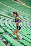woman jogging at athletics stadium