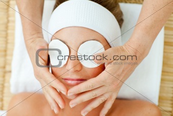 Pretty woman relaxing with a head massage