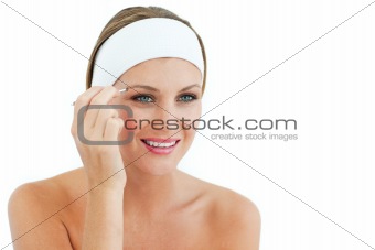 Pretty woman using tweezers