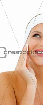 Beautiful woman applying a make-up base
