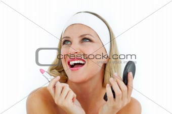 Radiant woman holding a lipstick 