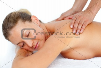 Relaxed woman receiving a massage 