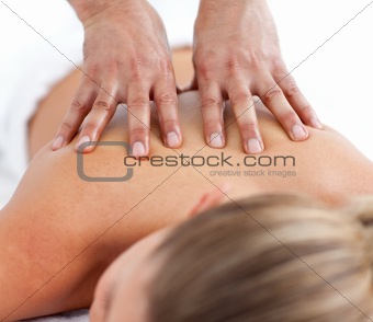 Relaxed woman being massaged 