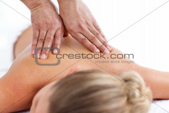 Relaxed woman being massaged