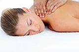 Relaxed woman receiving a back massage 