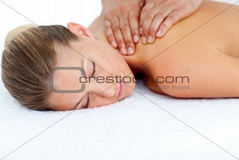 Relaxed woman receiving a back massage 