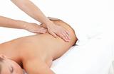 Young woman receiving a back massage