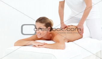 Cheerful woman receiving a massage 