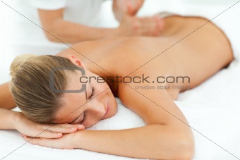 Concentrated woman enjoying a massage